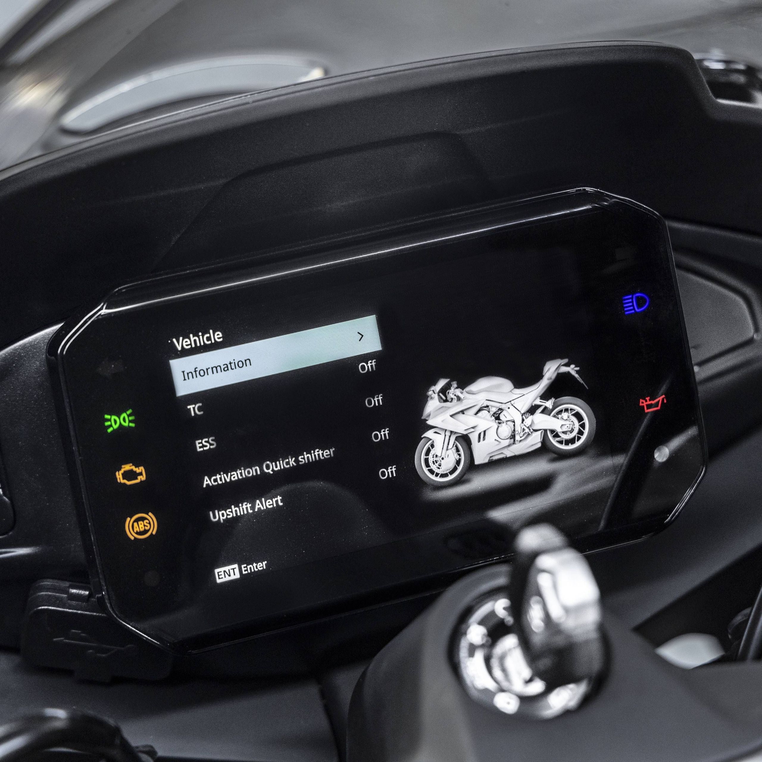 Mounted landscape colour display with a 675SR-R graphic and entries for vehicle information, traction control, ESS, quickshifter activation and upshift alert is visible.
